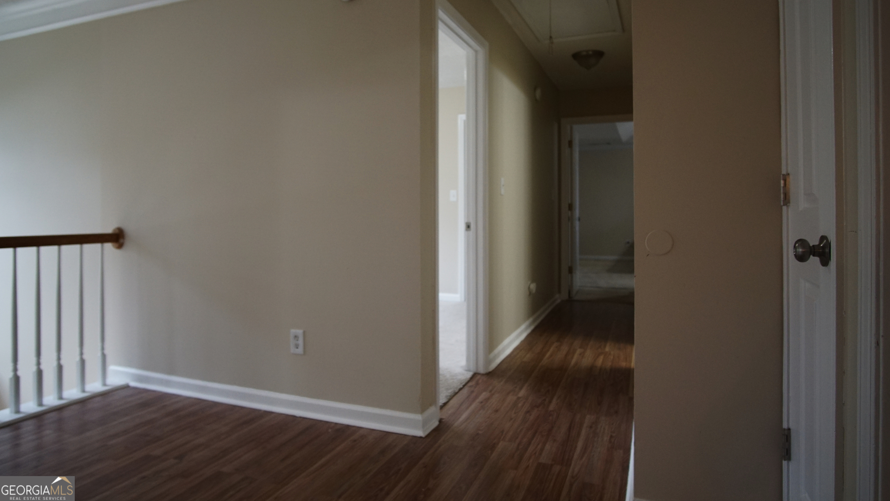130 Stephanie Lane Covington, GA 30016 - Photo 47 of 67 a view of a hallway with wooden floor