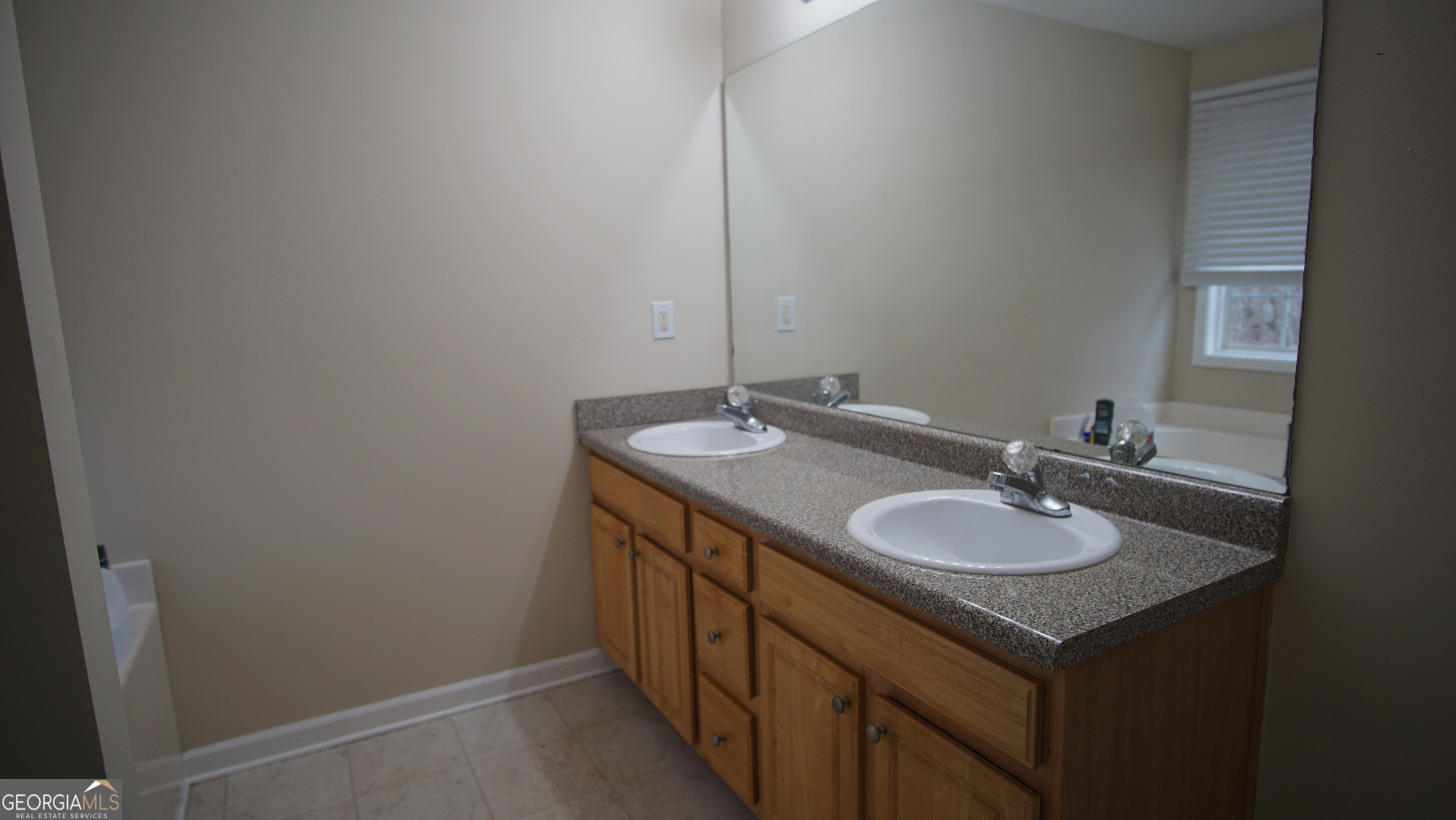 130 Stephanie Lane Covington, GA 30016 - Photo 51 of 67 a bathroom with a sink and a mirror
