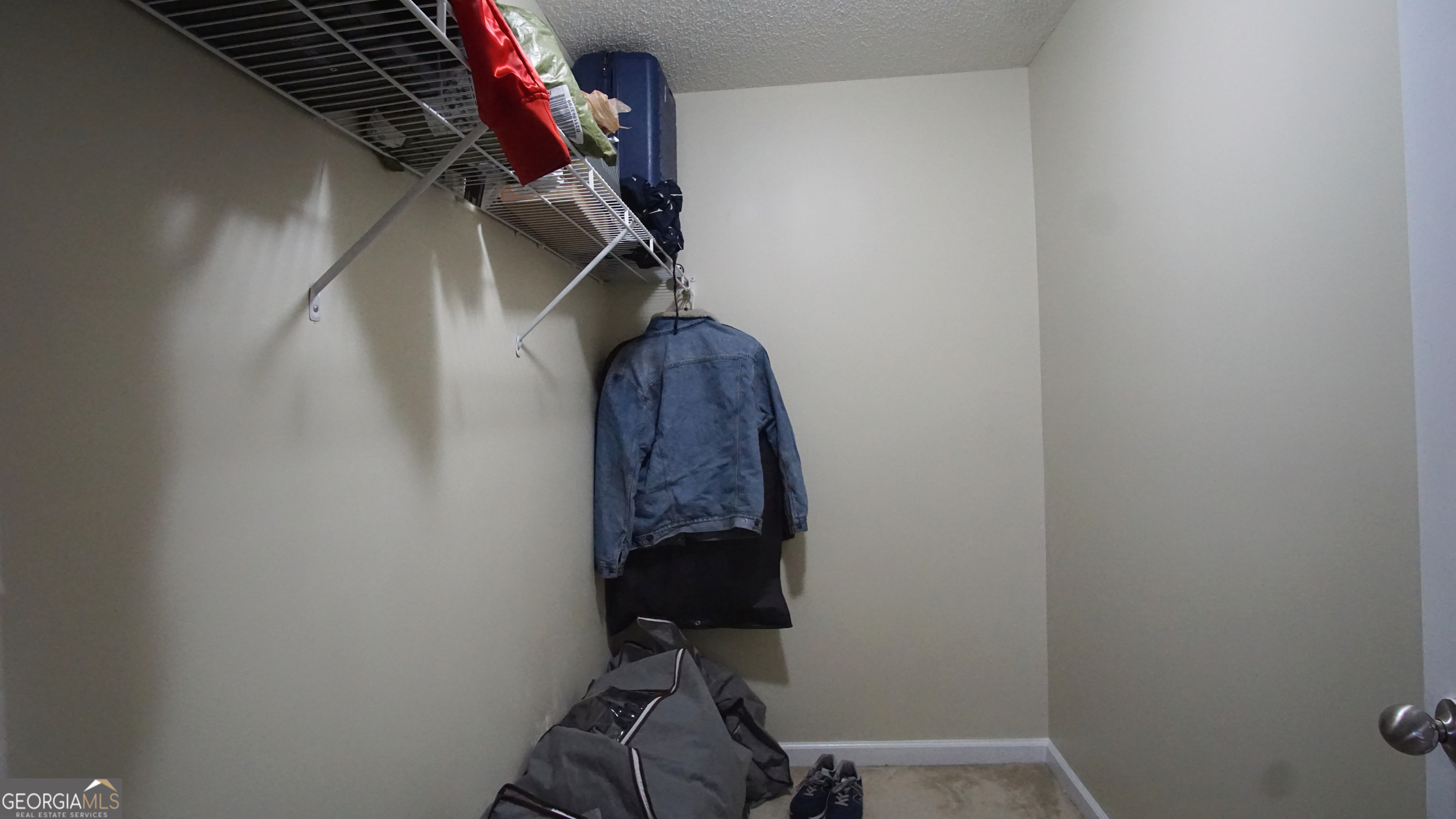 130 Stephanie Lane Covington, GA 30016 - Photo 54 of 67 a view of walk in closet with clothes