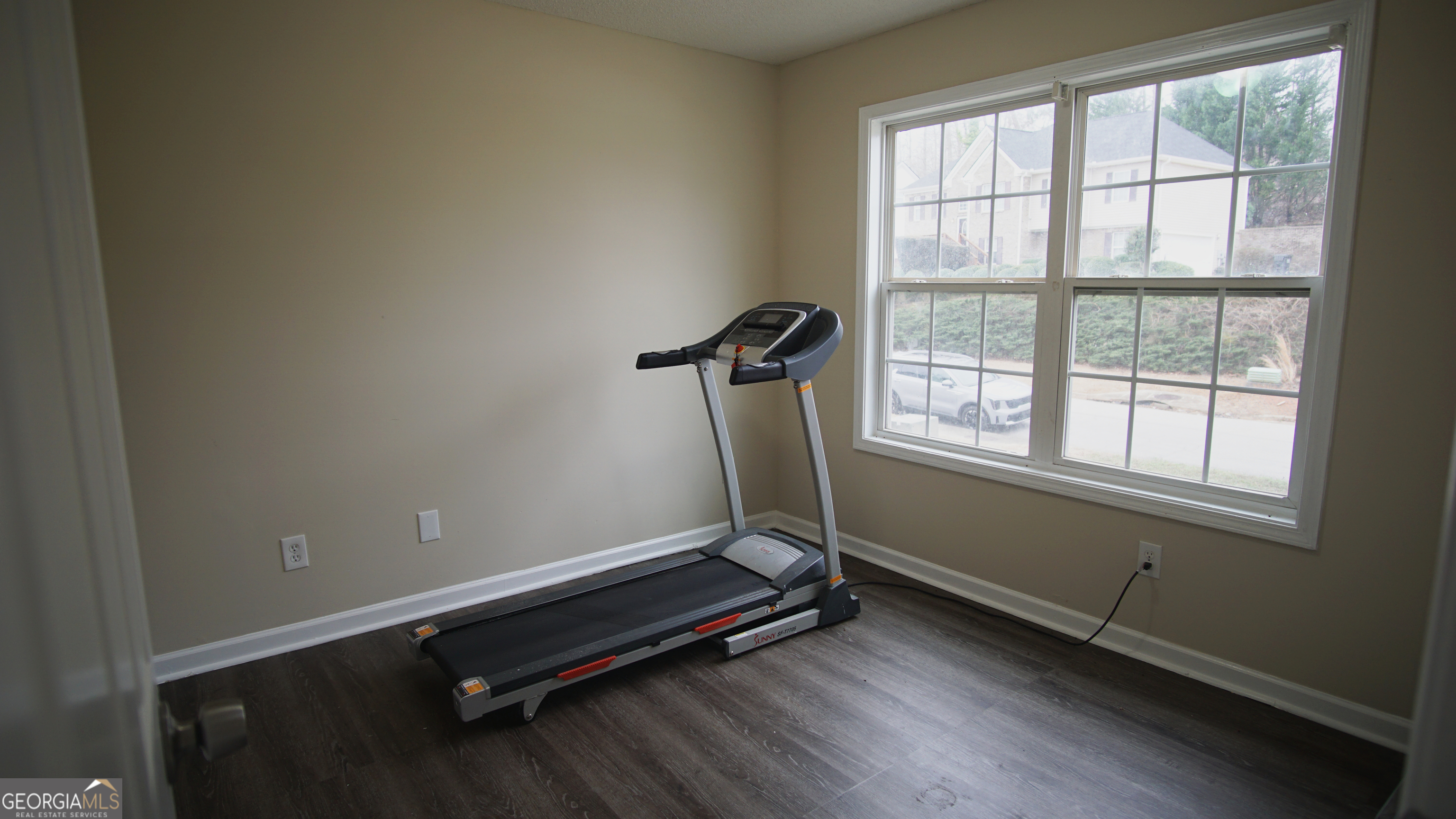 130 Stephanie Lane Covington, GA 30016 - Photo 55 of 67 a room with gym equipment on wooden floor