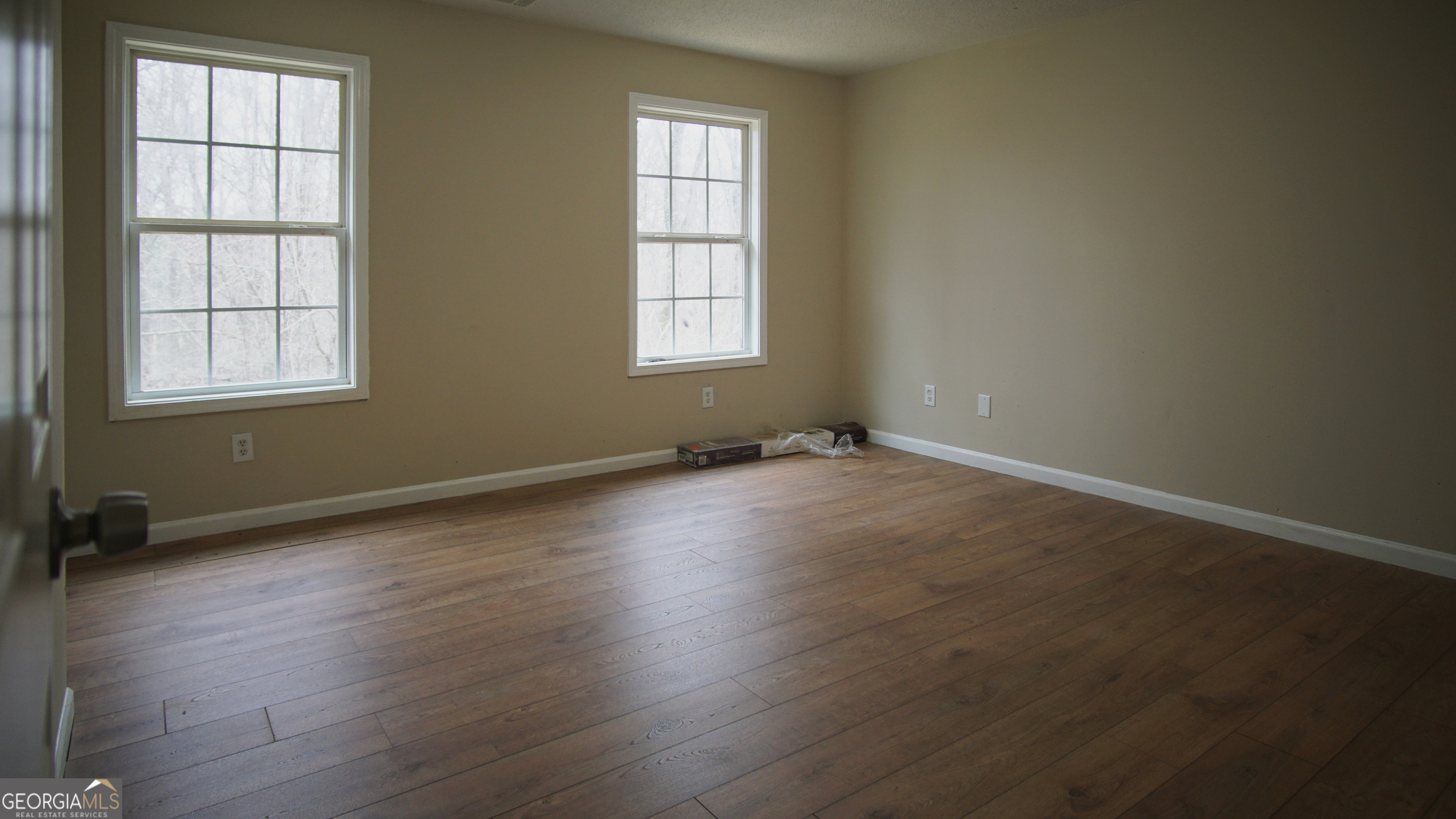 130 Stephanie Lane Covington, GA 30016 - Photo 56 of 67 an empty room with wooden floor and windows