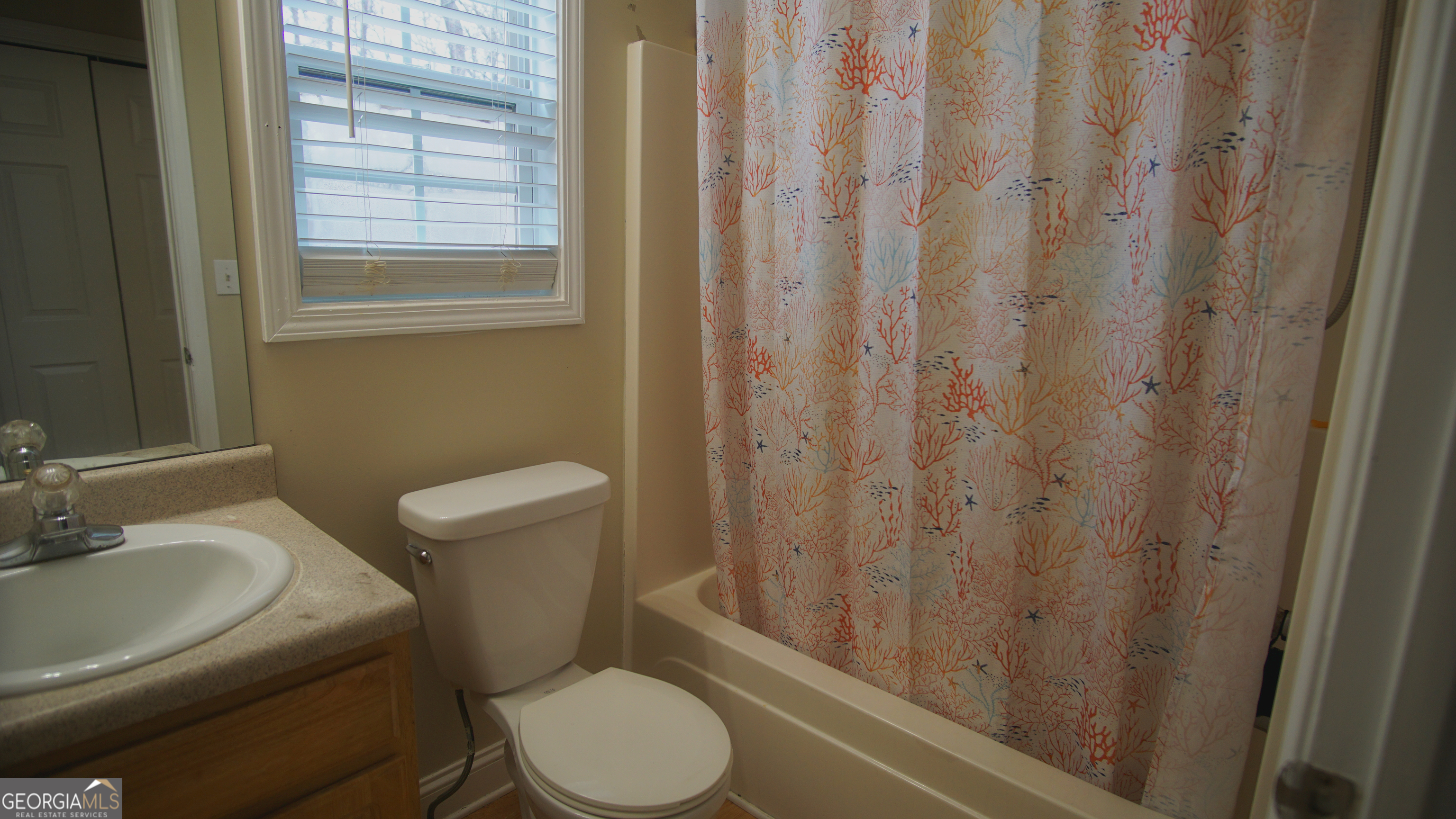 130 Stephanie Lane Covington, GA 30016 - Photo 60 of 67 a white toilet sitting next to a bathroom sink