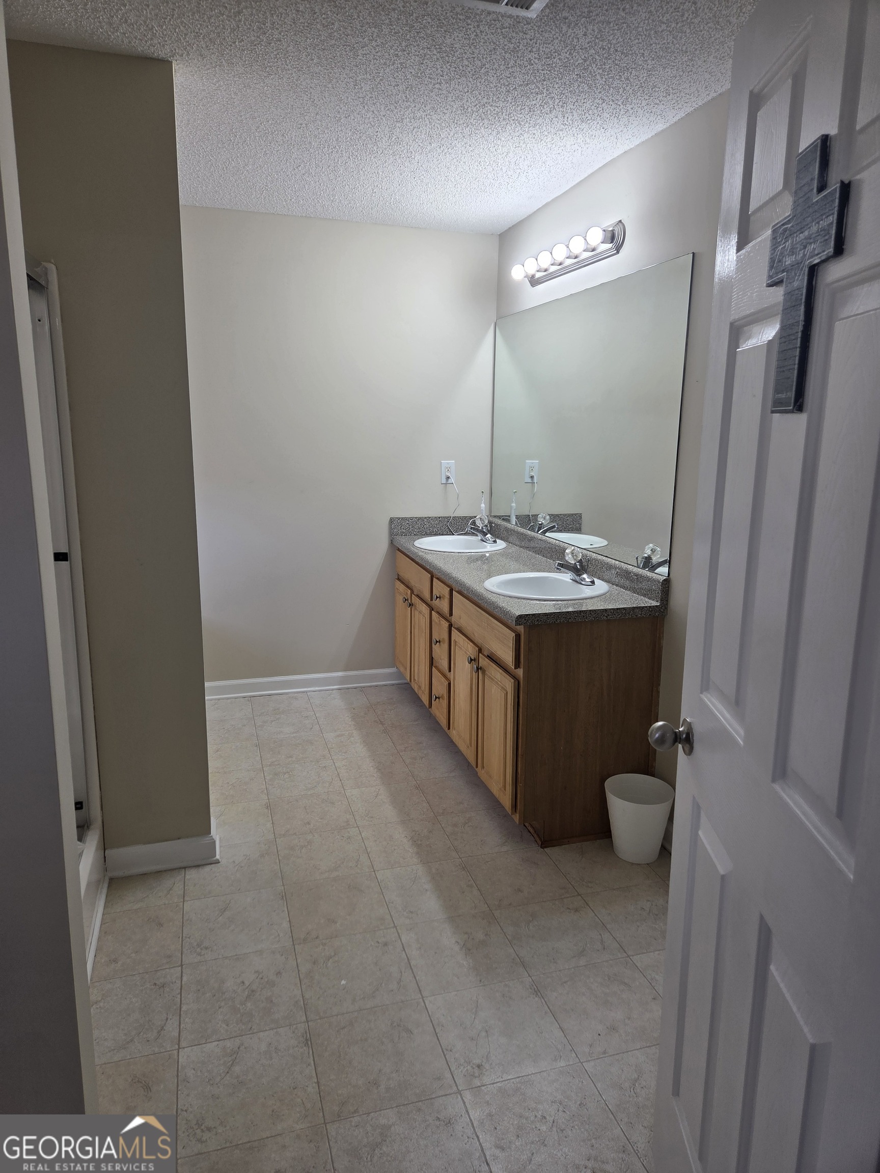 130 Stephanie Lane Covington, GA 30016 - Photo 9 of 18 a room with a sink and a mirror