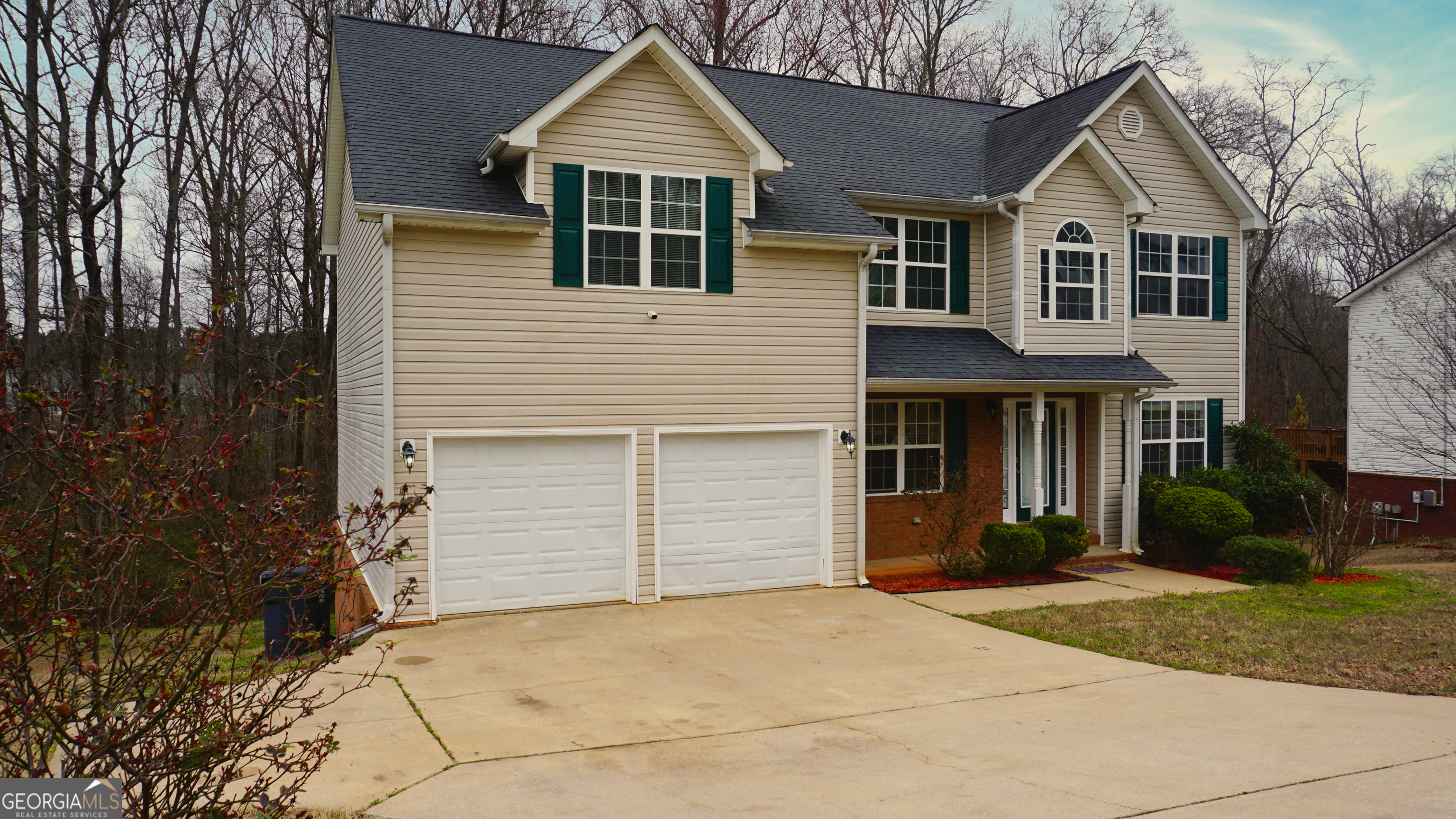 130 Stephanie Lane Covington, GA 30016 - Photo 10 of 67 a front view of a house with a yard and garage