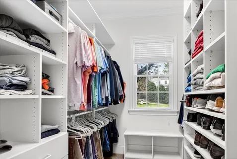 a workstation with a computer on a desk and a window