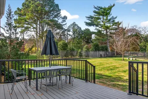 an aerial view of residential houses with outdoor space and street view