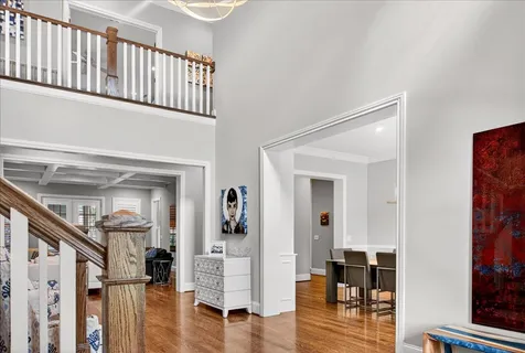a view of entryway with wooden floor and stairs