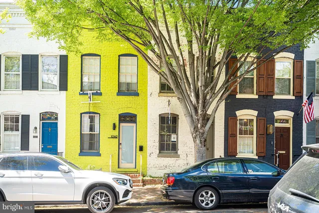a front view of a house with parking space