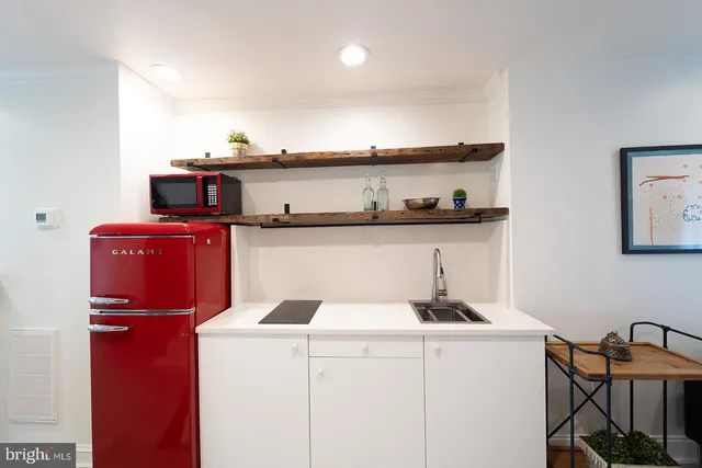 a kitchen with stainless steel appliances granite countertop a sink and cabinets