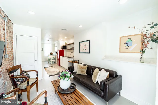 a living room with furniture and a couch