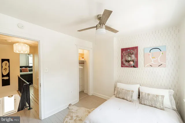 a bedroom with a bed and a view of bathroom