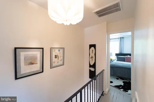 a view of a hallway with workspace