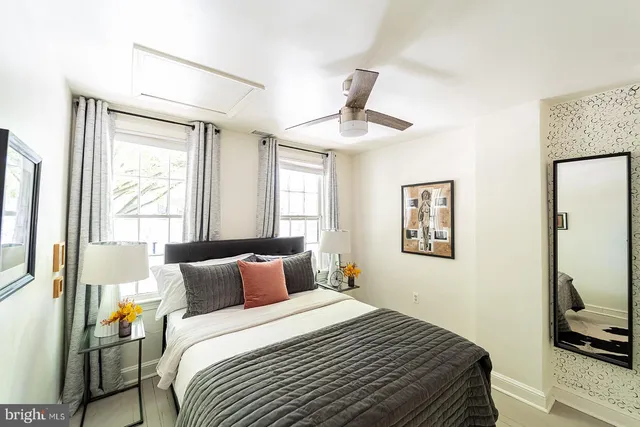 a bedroom with bed and window