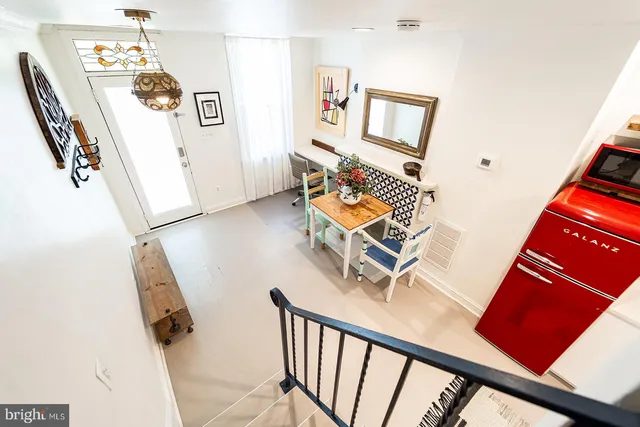 a view of a livingroom with furniture and stairs