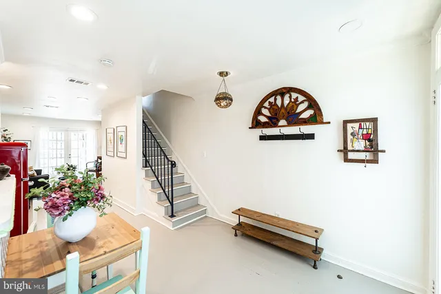 a view of room with furniture and wooden floor