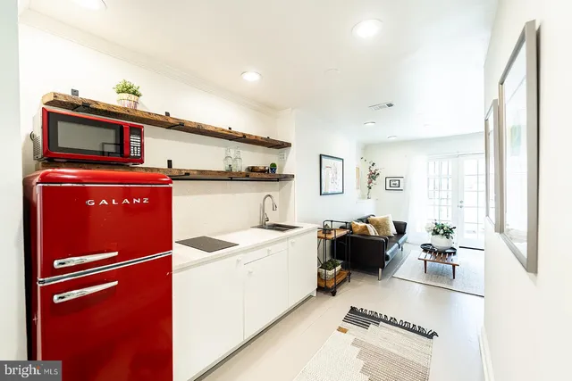 a kitchen with a refrigerator and a stove