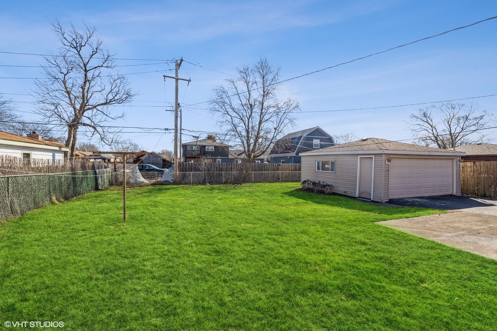 8713 Cranbrook Lane Bridgeview, IL 60455 - Photo 11 of 15 a view of a backyard with a garden and trees