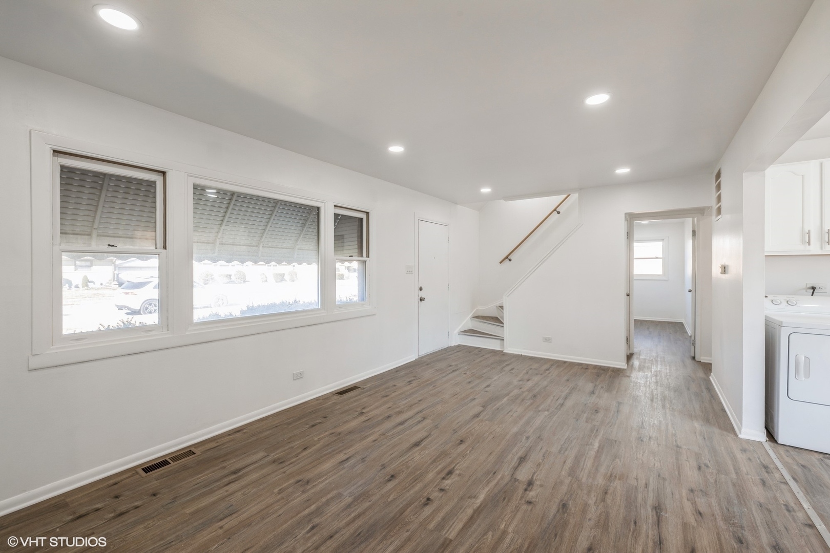 8713 Cranbrook Lane Bridgeview, IL 60455 - Photo 2 of 15 an empty room with wooden floor and windows