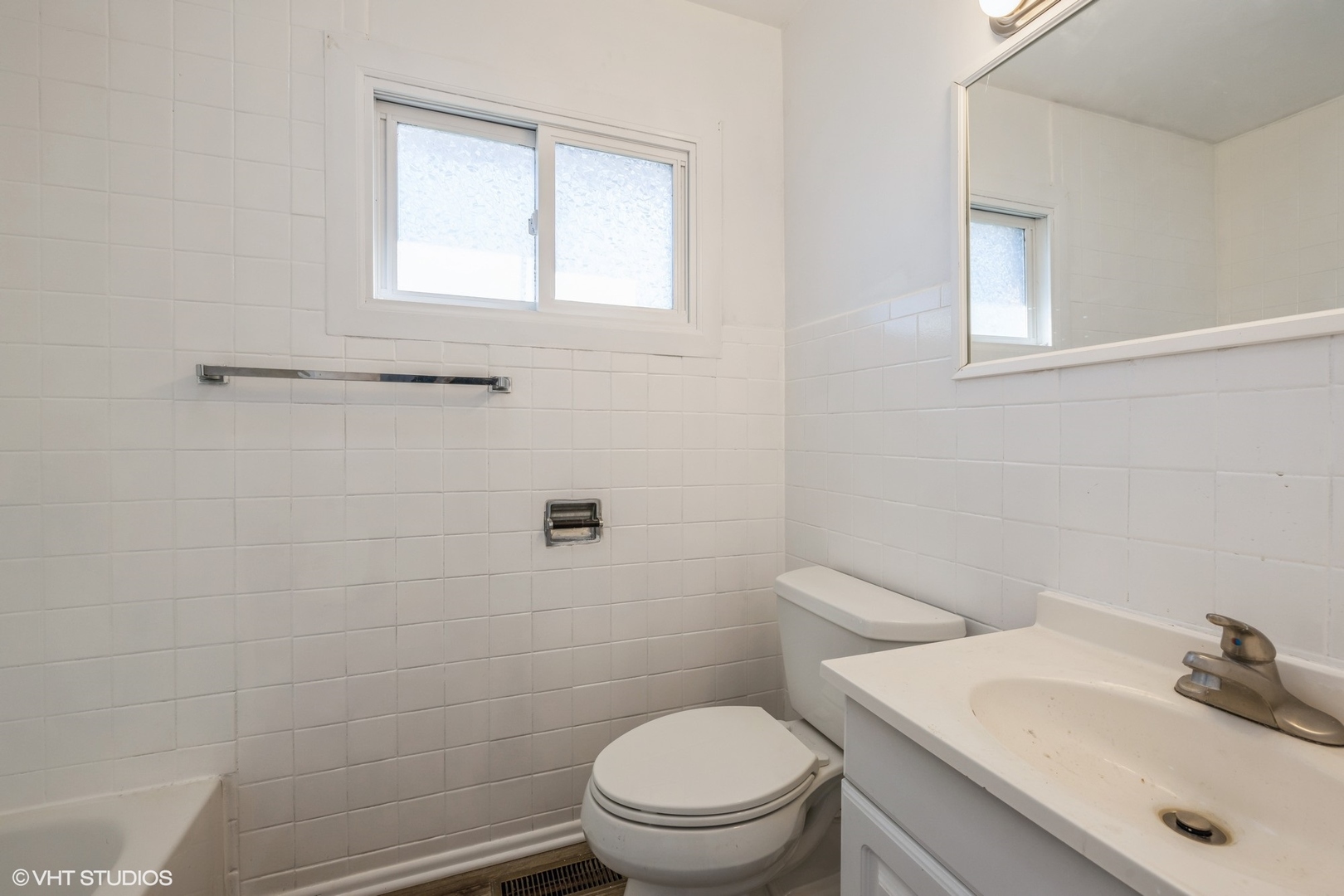 8713 Cranbrook Lane Bridgeview, IL 60455 - Photo 10 of 15 a bathroom with a sink a toilet and a mirror
