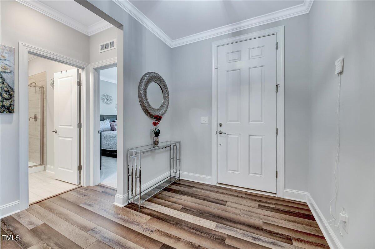 106 Mahogany Run Raleigh, NC 27610 - Photo 2 of 35 a view of a livingroom with wooden floor and white walls