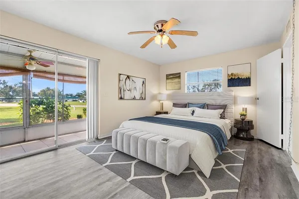 a bedroom with a bed and a chandelier
