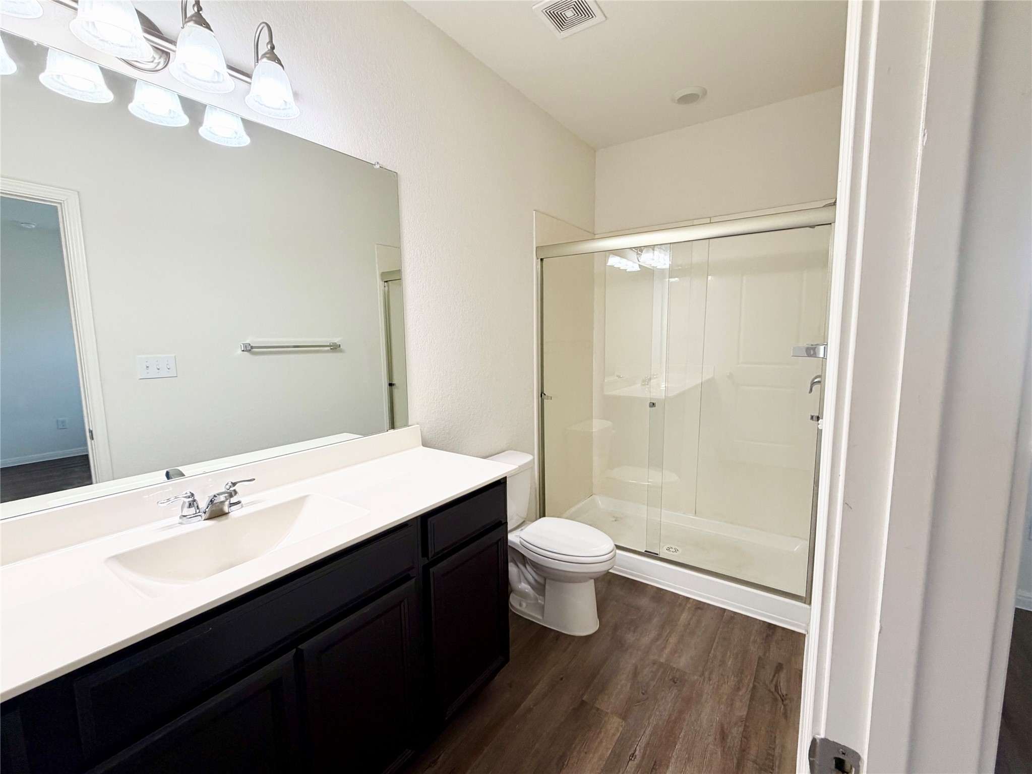 360 Bell Rings Drive Jarrell, TX 76537 - Photo 3 of 10 A well-appointed bathroom features a single vanity and a convenient walk-in shower.