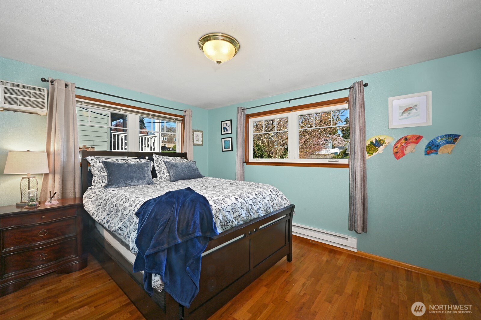8451 40th Avenue Southwest Seattle, WA 98136 - Photo 16 of 37 a bed sitting in a bedroom next to a window
