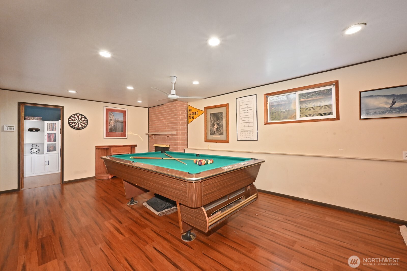 8451 40th Avenue Southwest Seattle, WA 98136 - Photo 18 of 37 a room with wooden floors and pool table