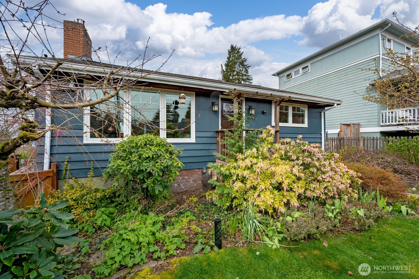 8451 40th Avenue Southwest Seattle, WA 98136 - Photo 2 of 37 front view of a house with a yard