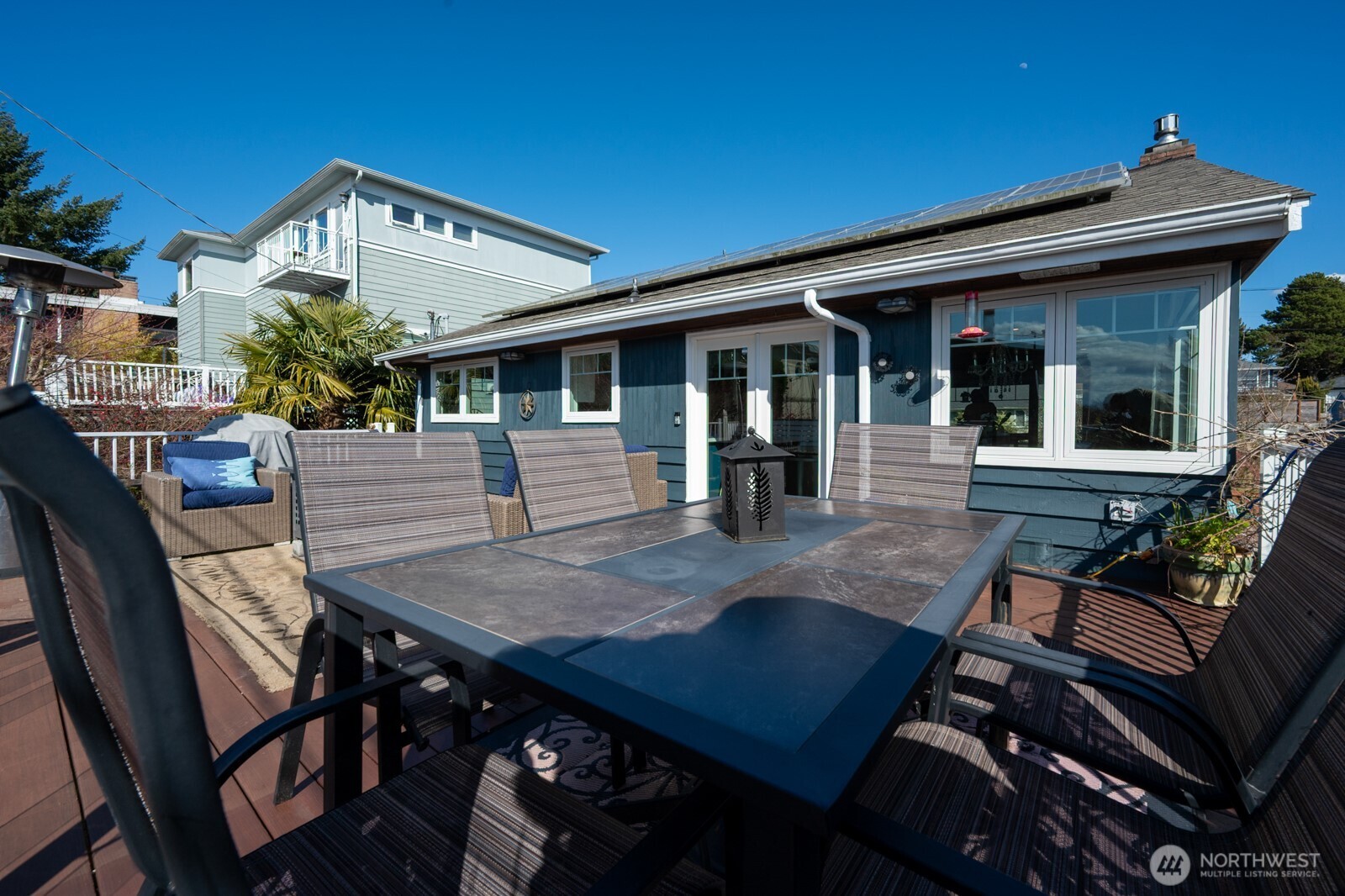 8451 40th Avenue Southwest Seattle, WA 98136 - Photo 28 of 37 a view of a dinning table and chairs in patio