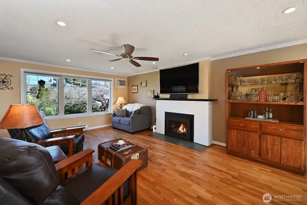 a living room with furniture fireplace and a flat screen tv