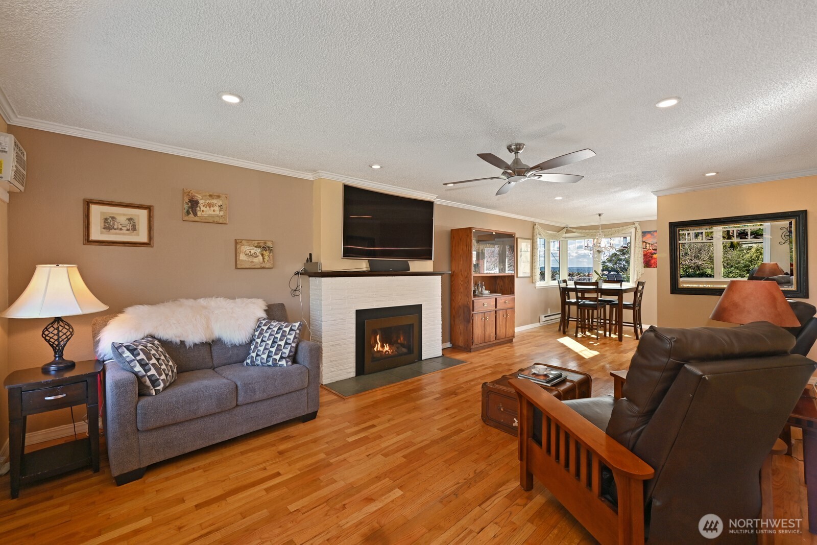 8451 40th Avenue Southwest Seattle, WA 98136 - Photo 7 of 37 a living room with furniture and a fireplace