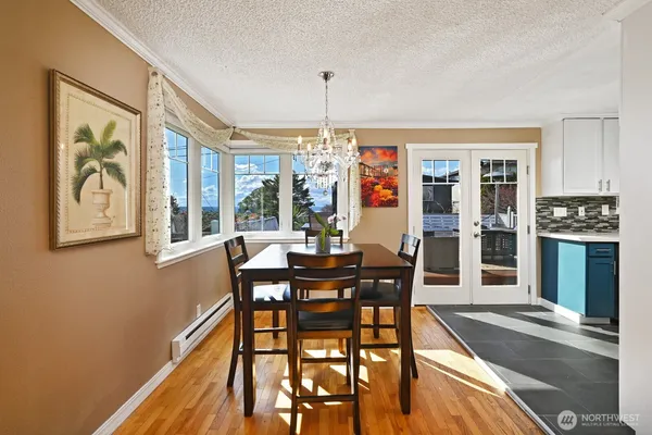 a view of a dining room with furniture window and wooden floor