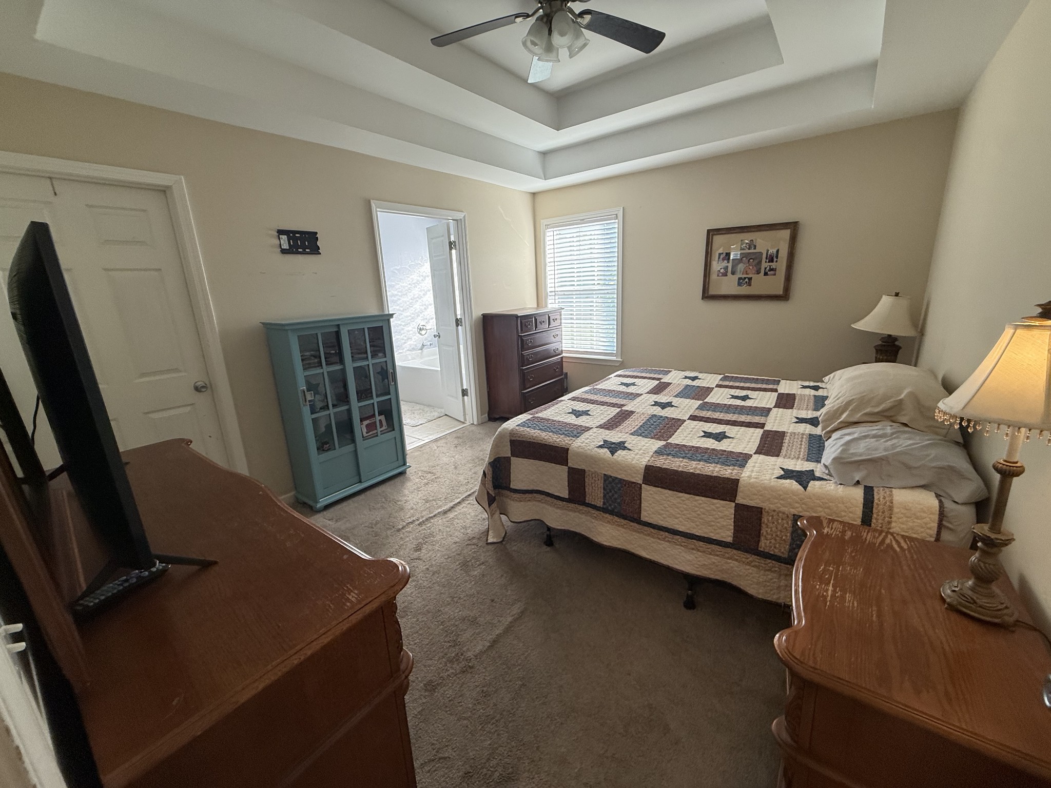 1702 Abiff Road Burns, TN 37029 - Photo 33 of 47 a bedroom with a bed and a flat screen tv