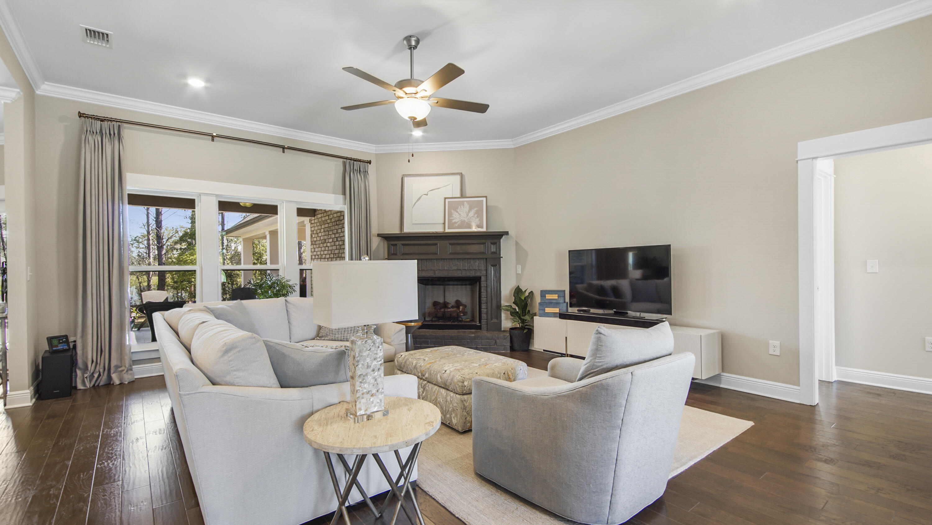194 Mill Pond Cove Freeport, FL 32439 - Photo 11 of 89 a living room with furniture a fireplace and a flat screen tv