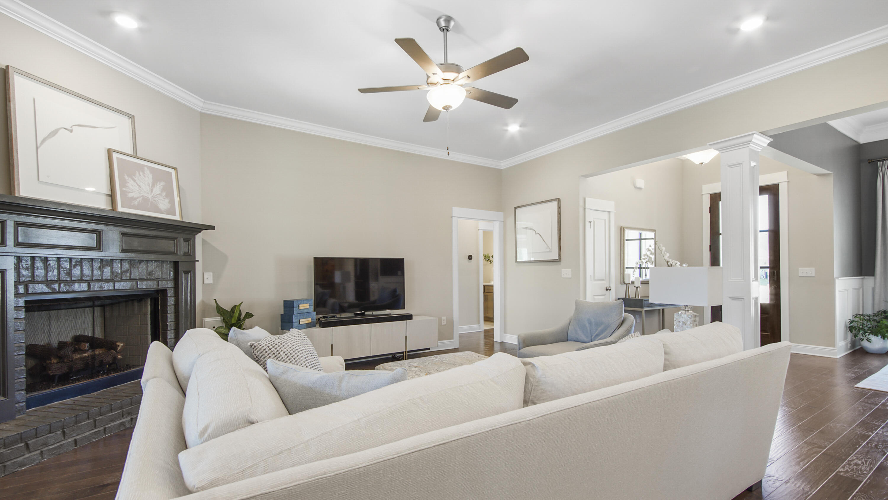 194 Mill Pond Cove Freeport, FL 32439 - Photo 16 of 89 a living room with furniture a fireplace and a flat screen tv