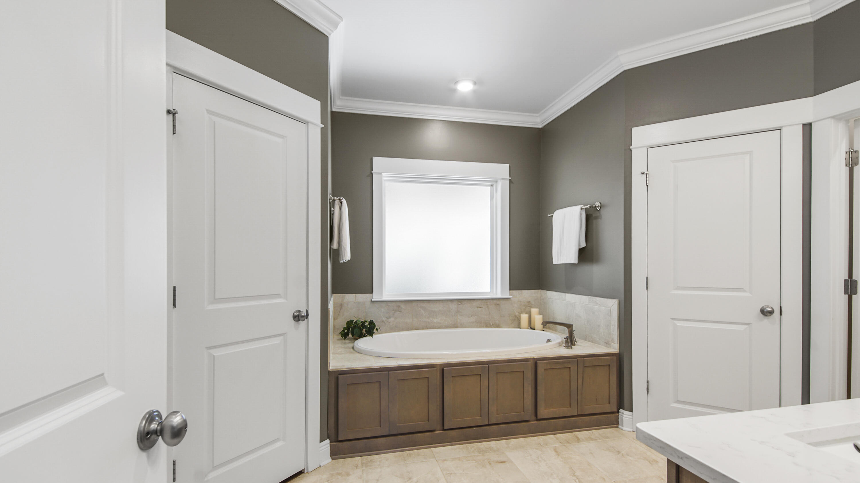 194 Mill Pond Cove Freeport, FL 32439 - Photo 22 of 89 a spacious bathroom with a tub sink and mirror