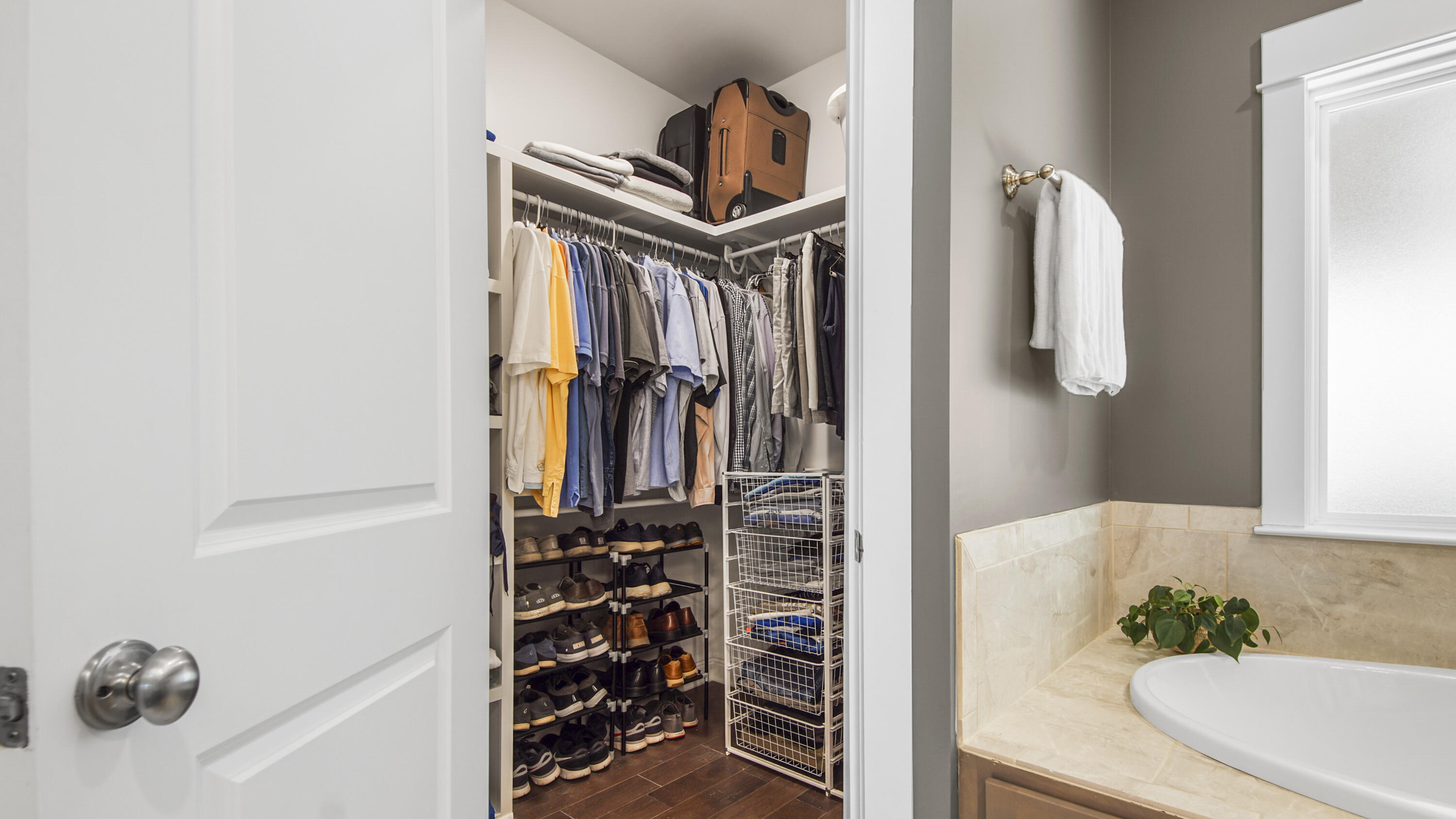 194 Mill Pond Cove Freeport, FL 32439 - Photo 25 of 89 a view of walk in closet with clothes and shoes