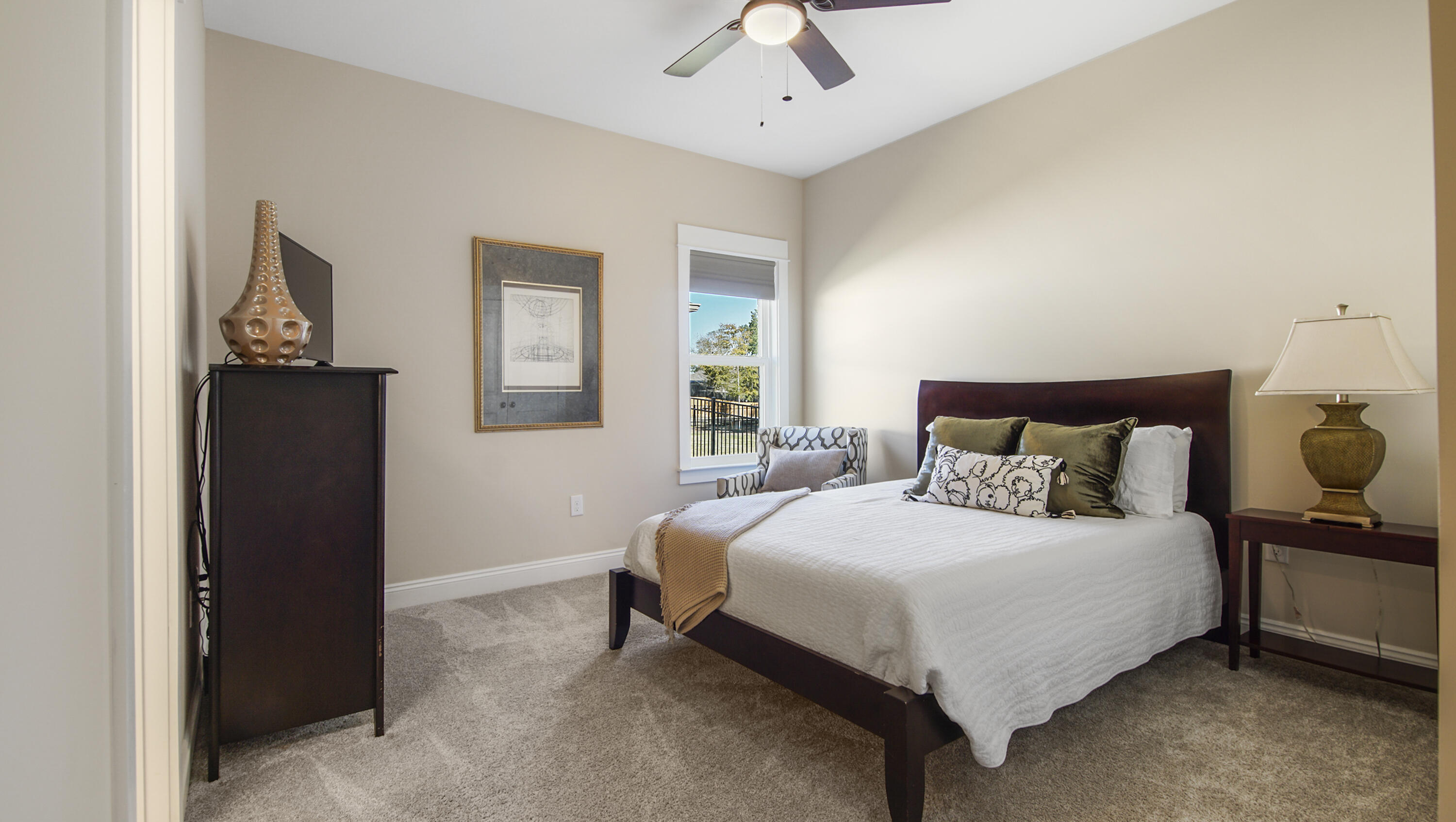 194 Mill Pond Cove Freeport, FL 32439 - Photo 29 of 89 a bedroom with a bed and a chandelier