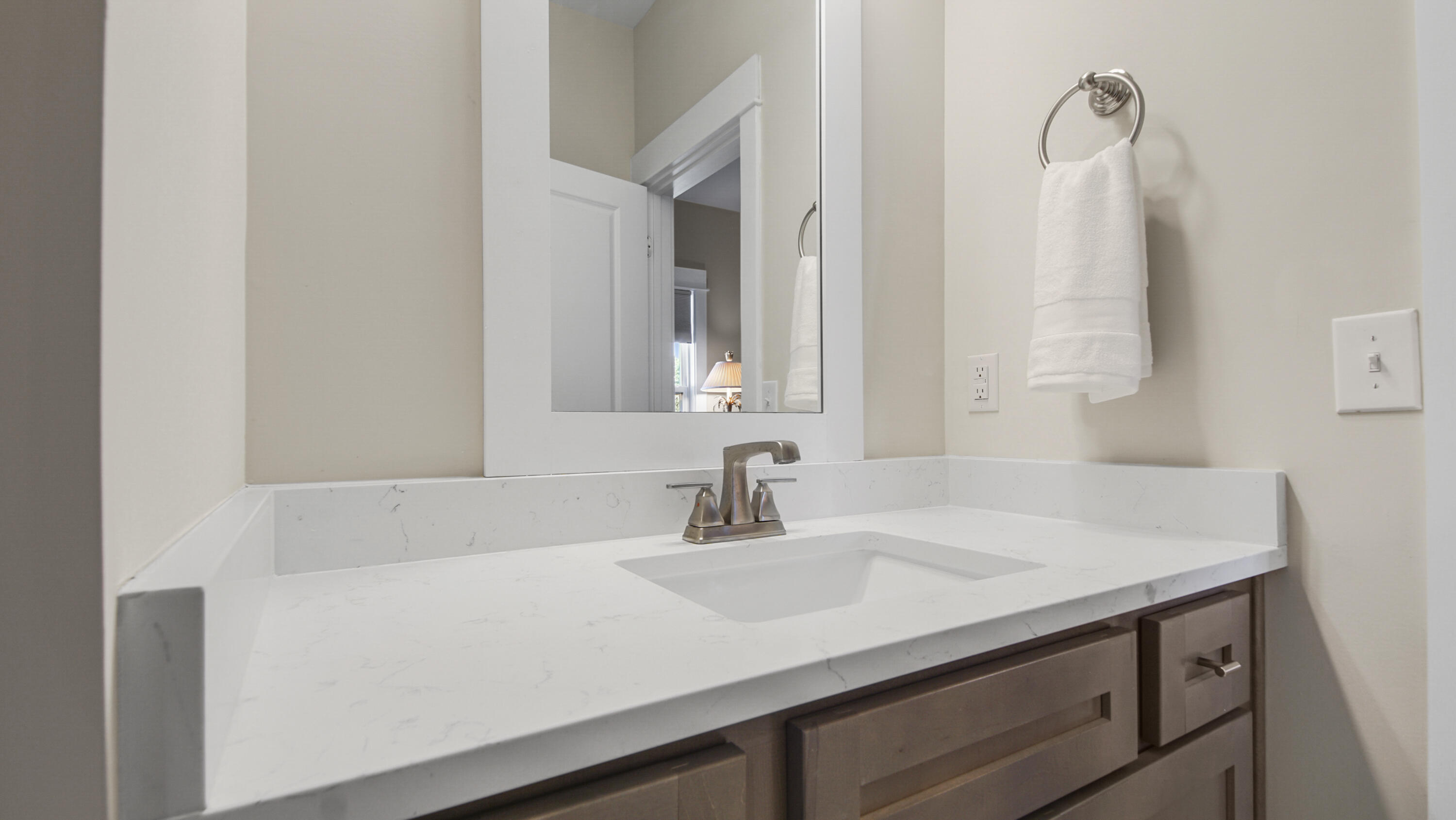 194 Mill Pond Cove Freeport, FL 32439 - Photo 33 of 89 a bathroom with a sink and a mirror