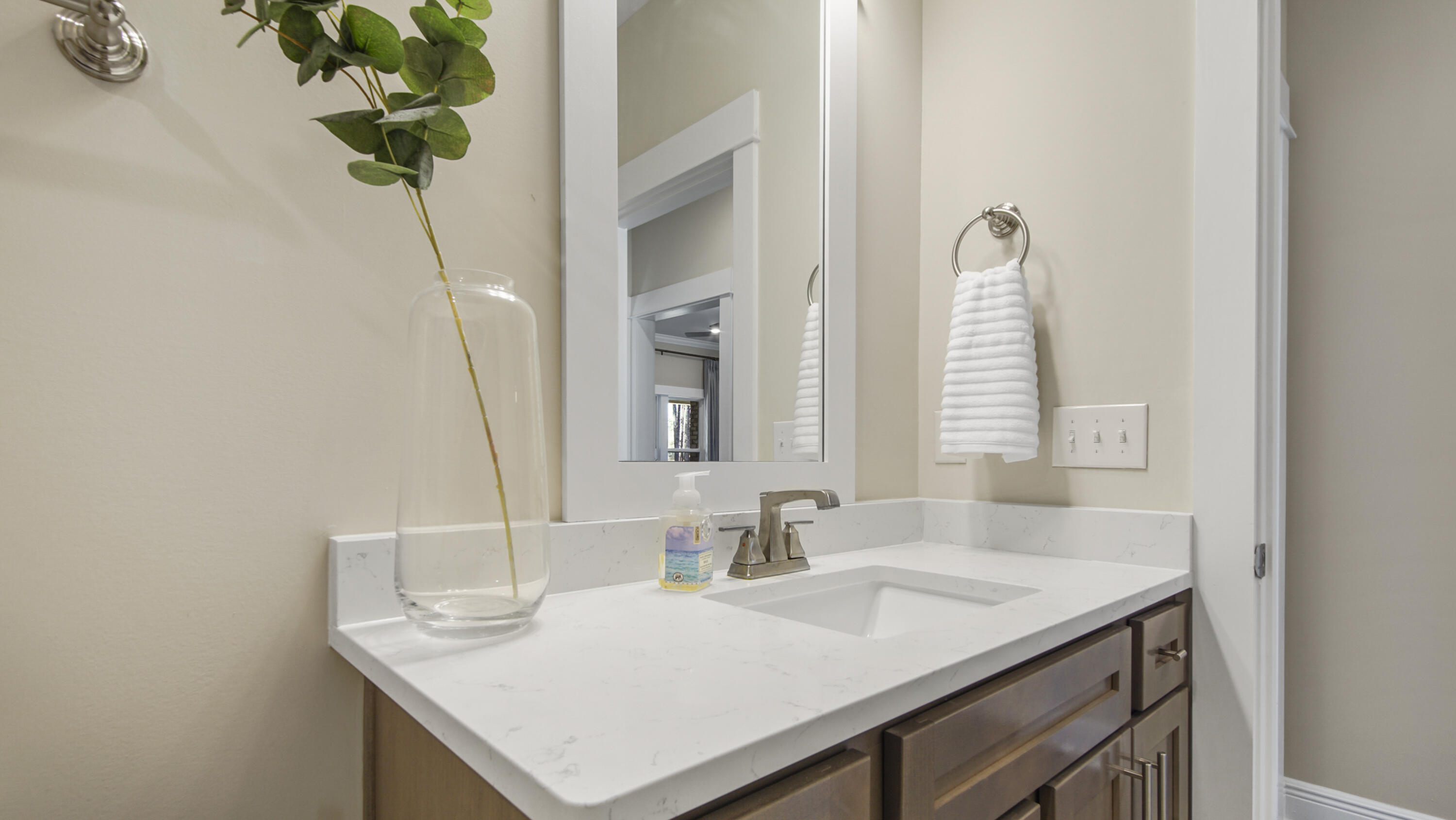 194 Mill Pond Cove Freeport, FL 32439 - Photo 37 of 89 a bathroom with a sink a vanity and a mirror