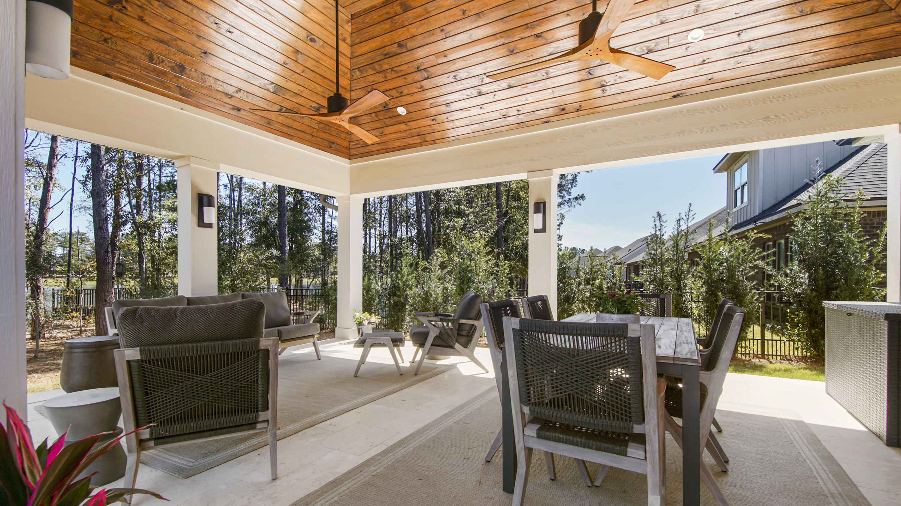 194 Mill Pond Cove Freeport, FL 32439 - Photo 42 of 89 a view of a patio with a dining table and chairs with wooden floor and fence