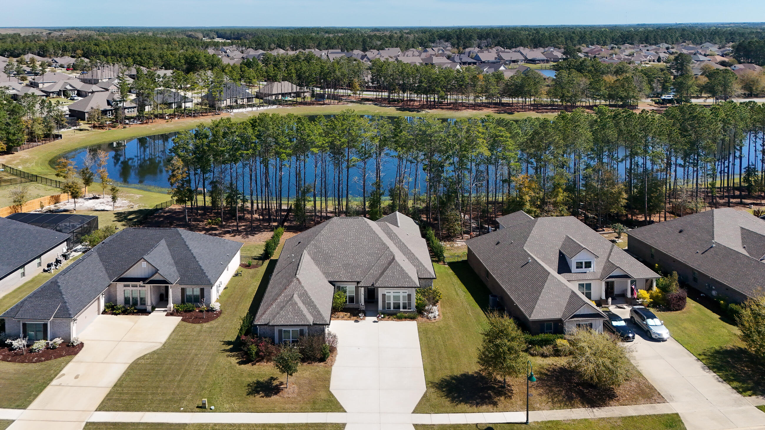 194 Mill Pond Cove Freeport, FL 32439 - Photo 50 of 89 an aerial view of houses with a swimming pool