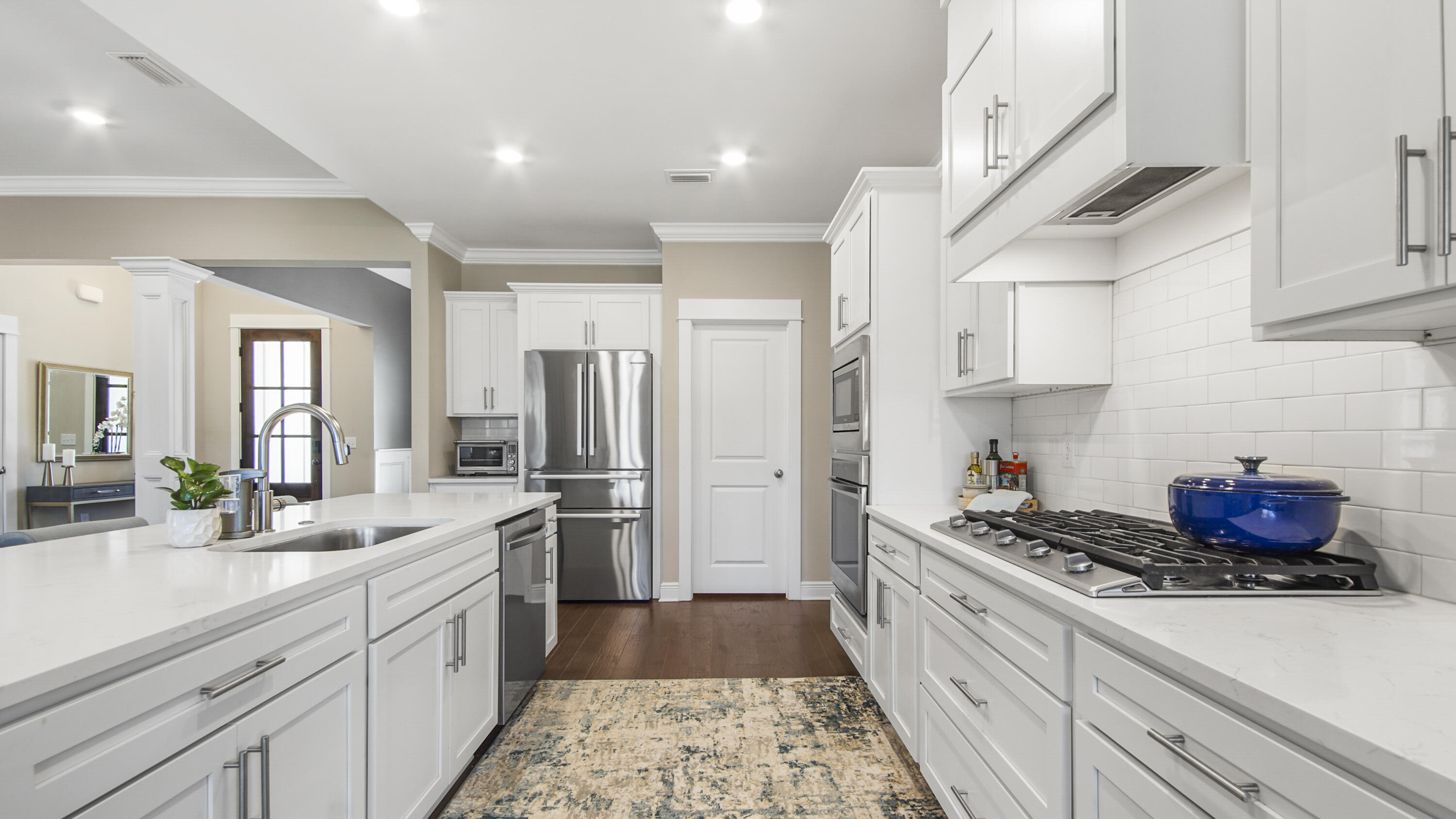 194 Mill Pond Cove Freeport, FL 32439 - Photo 8 of 89 a kitchen with stainless steel appliances kitchen island granite countertop a sink stove and refrigerator