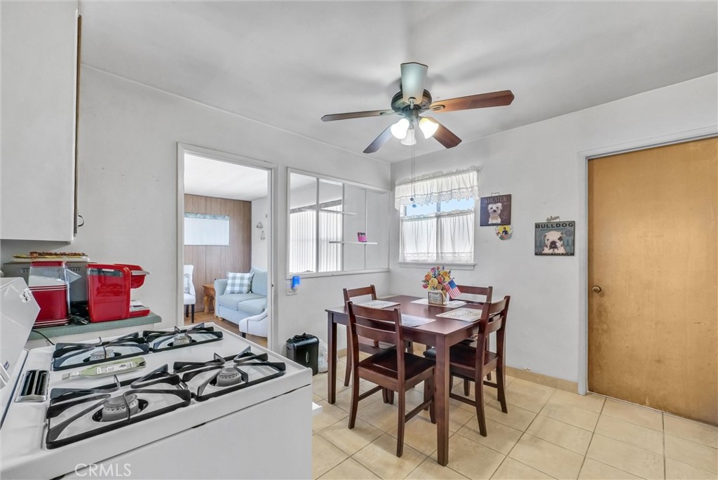 2551 Rome Avenue Anaheim, CA 92804 - Photo 9 of 27 a view of a dining room with furniture window and wooden floor