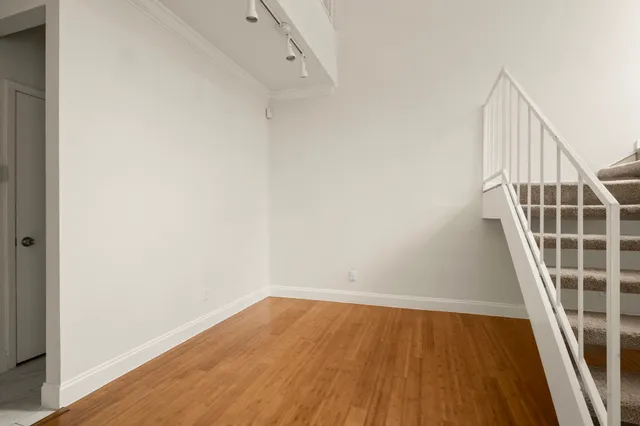 a view of entryway with wooden floor