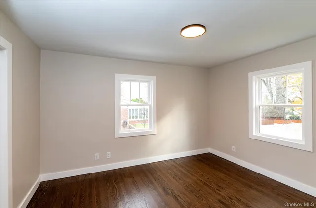 a spacious bathroom with a bathtub and a sink