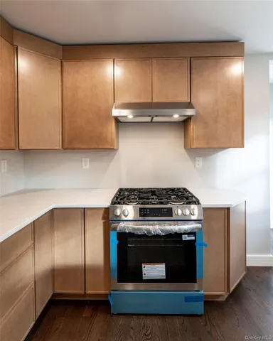 a view of an empty room with windows