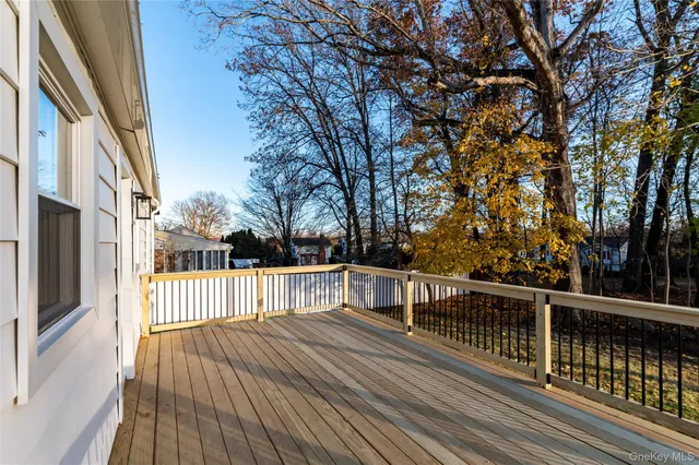 a view of a balcony with wooden floor