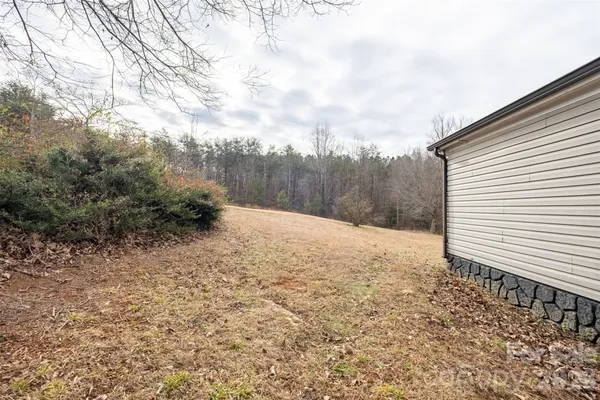 a view of a backyard of the house